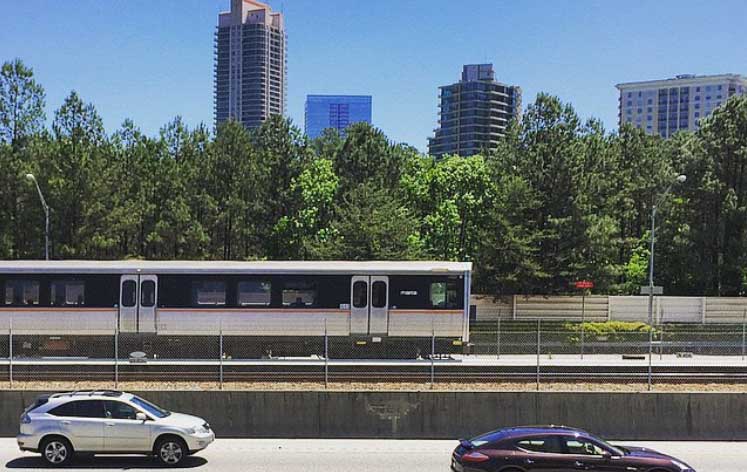 A MARTA train moving along beside 1-20