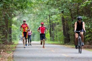 runners and bikers on trail