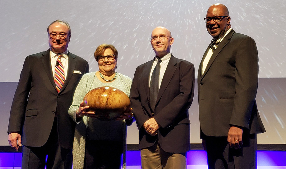 Clara Axam receives the Harry West Award