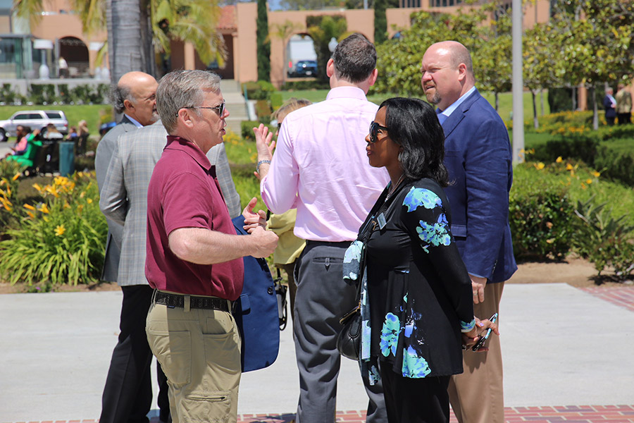 Photo - Jim Durrett, executive director of the Buckhead Community Improvement District, talks with Pat Upshaw-Monteith, president and CEO of Leadership Atlanta during a break at Liberty Station.