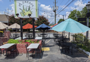 Umbrella tables in the parking lot of El Zarape restaurant in Roswell.