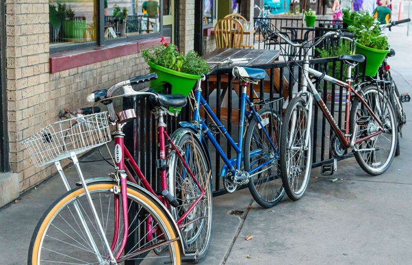 bikes leaning against a bike rack