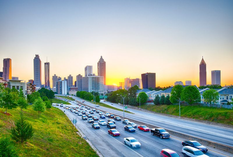 traffic with Atlanta skyline at sunset