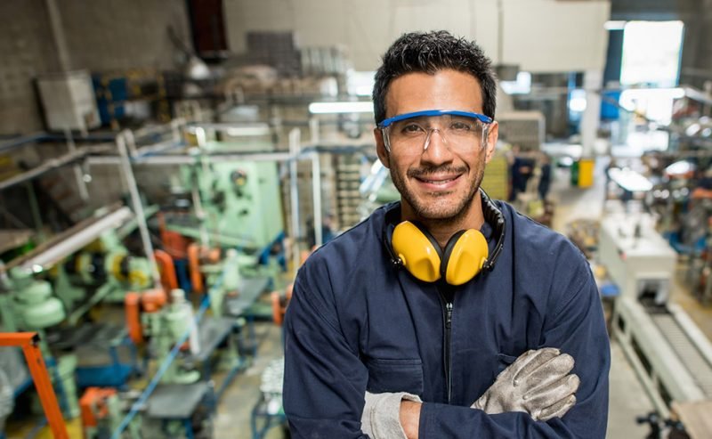 worker posing in a factory 