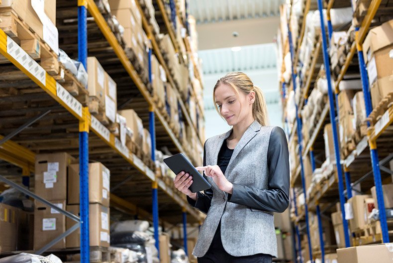 woman on tablet in warehouse