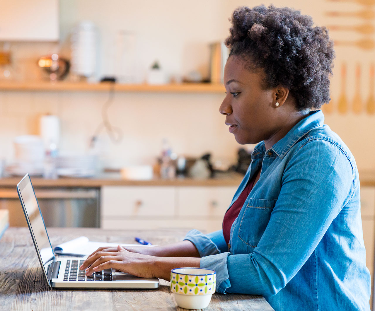 Woman working on her computer at home