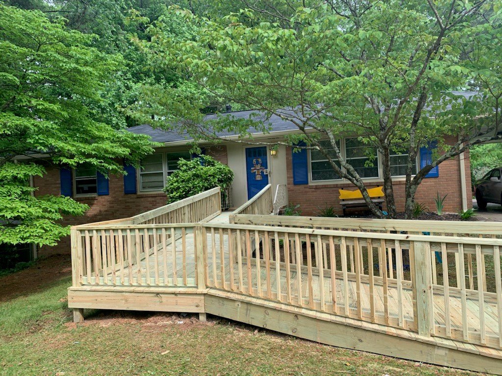 Front view of a home with retrofitted porch.