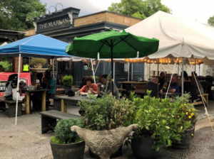 Diners at The Marlay in Decatur sitting at covered outdoor dining area.