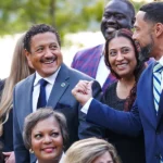 RLI members talking casually as they prepare for their class picture