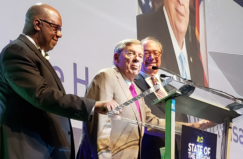 Doug Hooker, Senator Johnny Isakson, and Kerry Armstrong at the State of the Region Breakfast